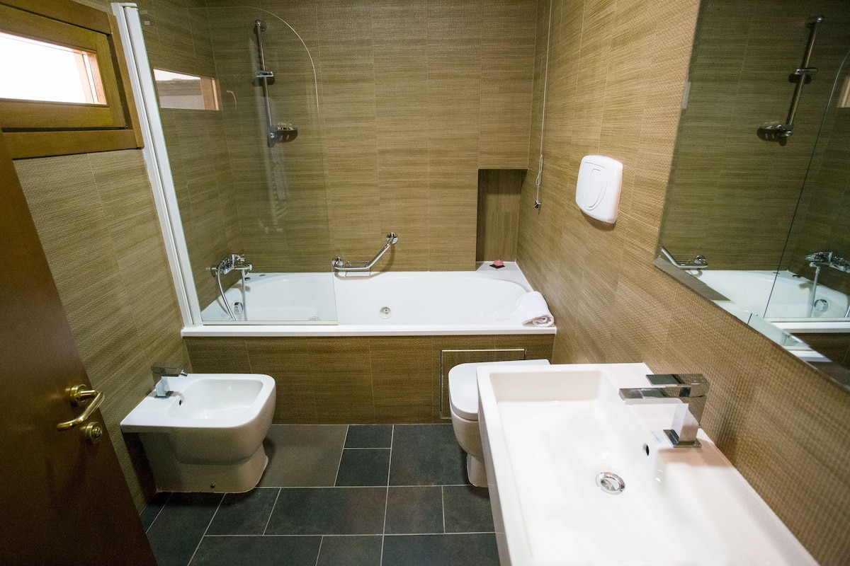 superior double room | bathroom | rainfall showerhead, free toiletries, hair dryer, slippers