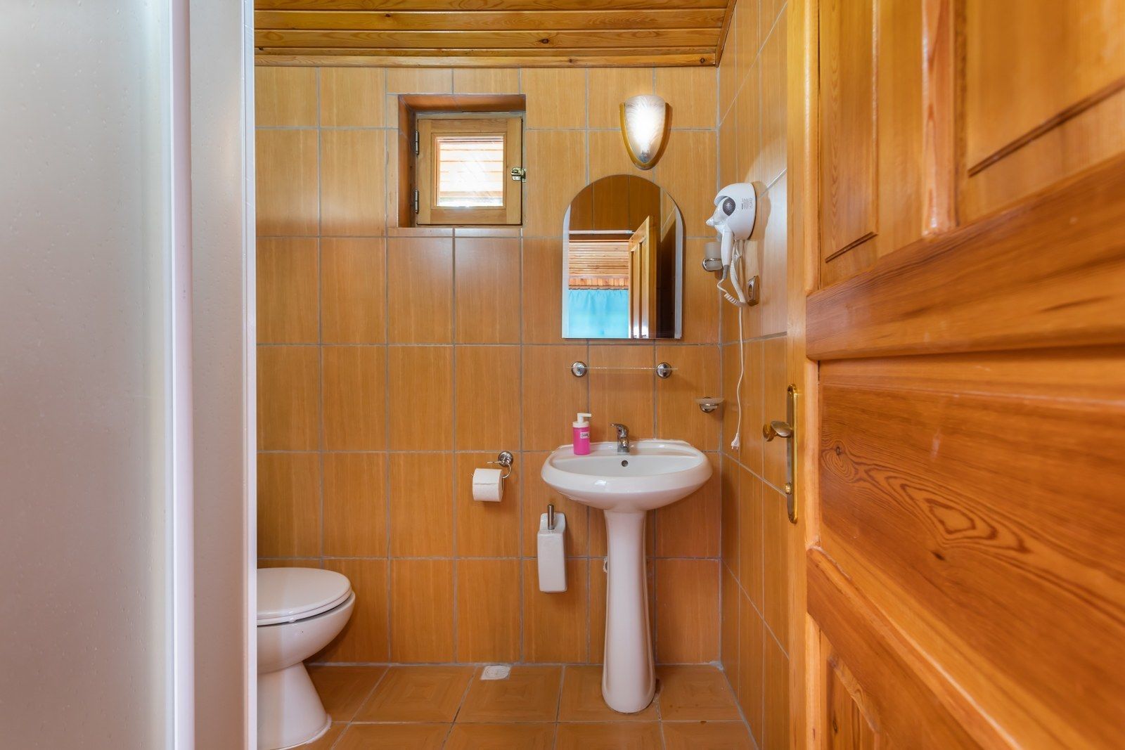 shower, hair dryer, slippers, towels