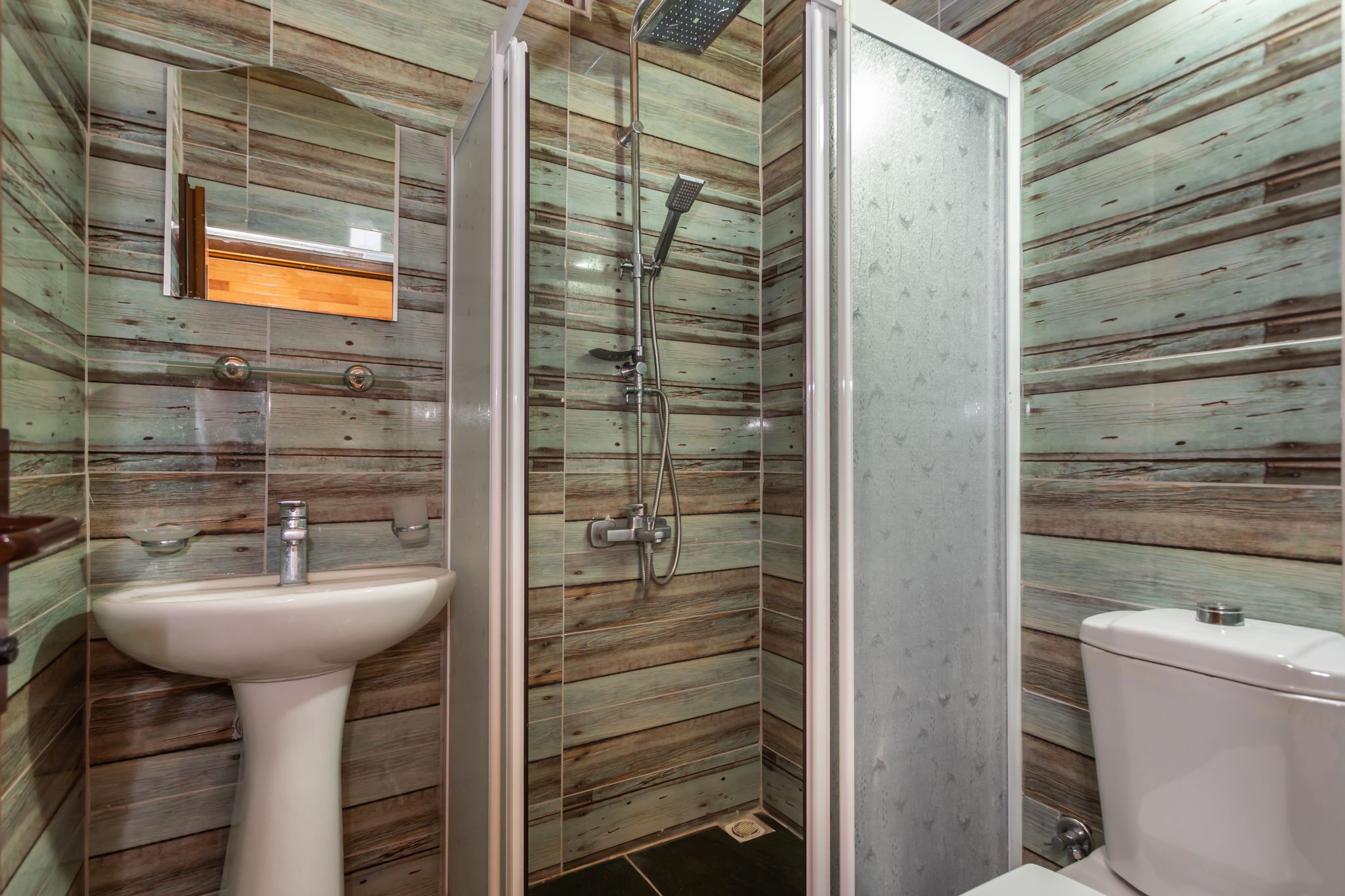 deluxe suite | bathroom | shower, hair dryer, slippers, towels