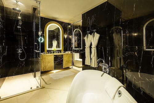 Separate bathtub and shower, designer toiletries, bathrobes, slippers