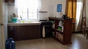 Six-Bedroom House | Private kitchen | Stovetop, cookware/dishes/utensils - Ramyer Transient House Panglao (Dauis)