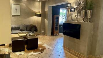 Deluxe Apartment, 2 Bedrooms, Non Smoking, Fireplace | Living area | 30-inch LCD TV with satellite channels, TV