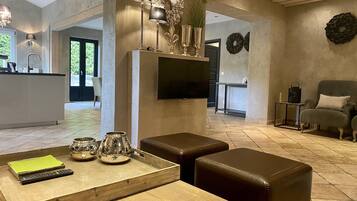 Deluxe Apartment, 2 Bedrooms, Non Smoking, Fireplace | Living area | 30-inch LCD TV with satellite channels, TV