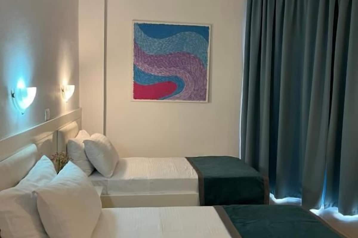 Triple Room, Garden View | Desk, iron/ironing board, free WiFi, bed sheets