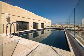 Seasonal outdoor pool, pool umbrellas, pool loungers