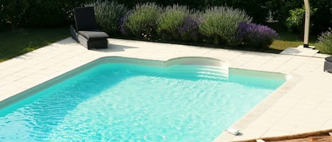 Seasonal outdoor pool, open 8:30 AM to 8:00 PM, pool umbrellas