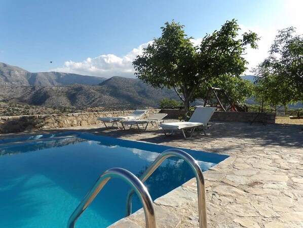 Seasonal outdoor pool, pool loungers