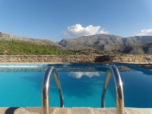 Seasonal outdoor pool, pool loungers