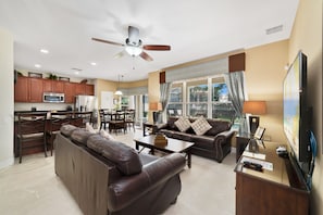 Relax in a spacious room with a seating area, flat-screen TV, and kitchenette.