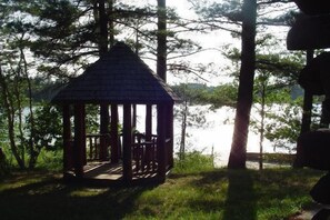 Property grounds - Lakeside Log Home, dog-friendly, fireplace, free boats, fishing, swimming (gaylord)
