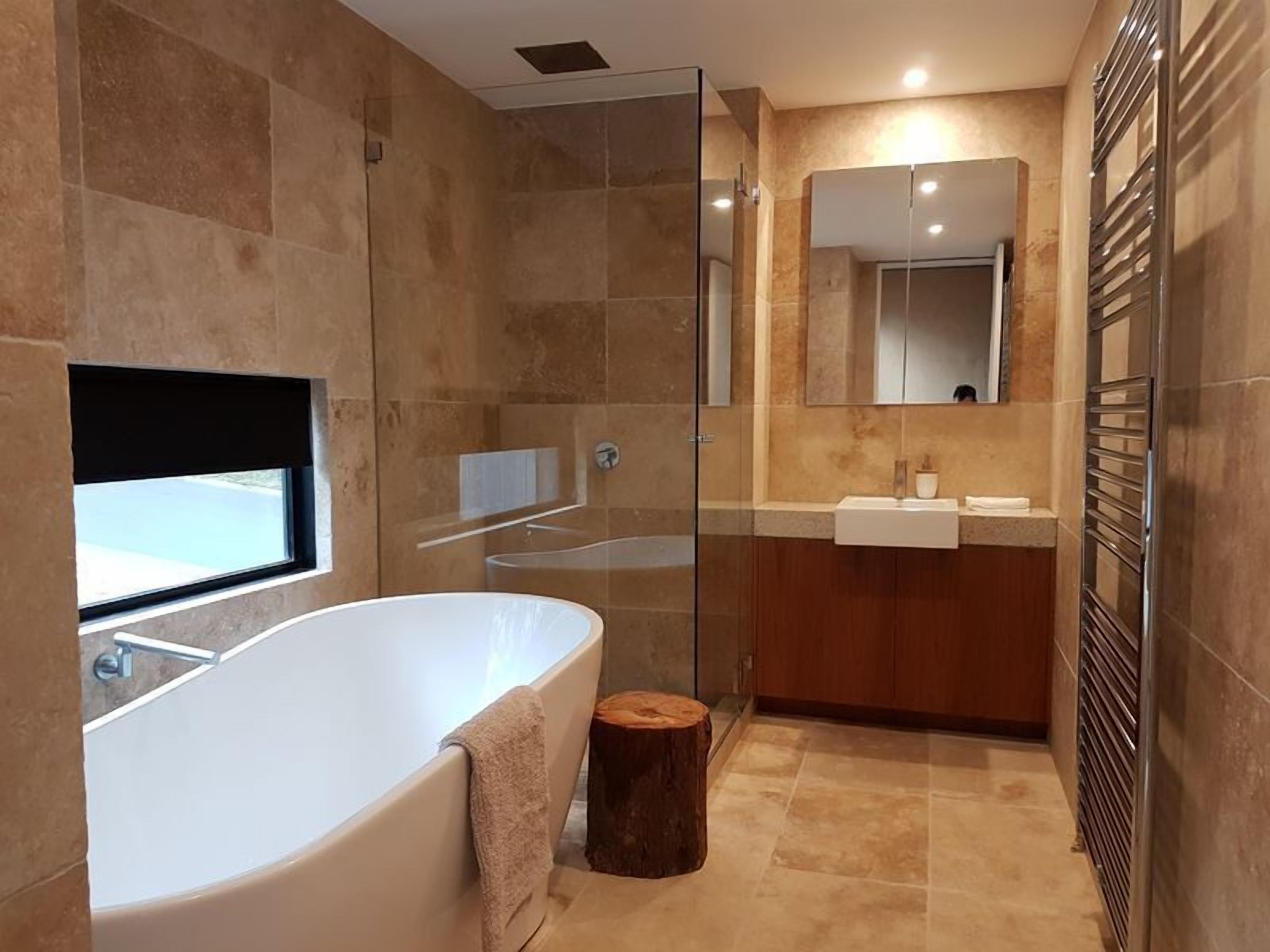 Bathtub, hair dryer, towels, soap