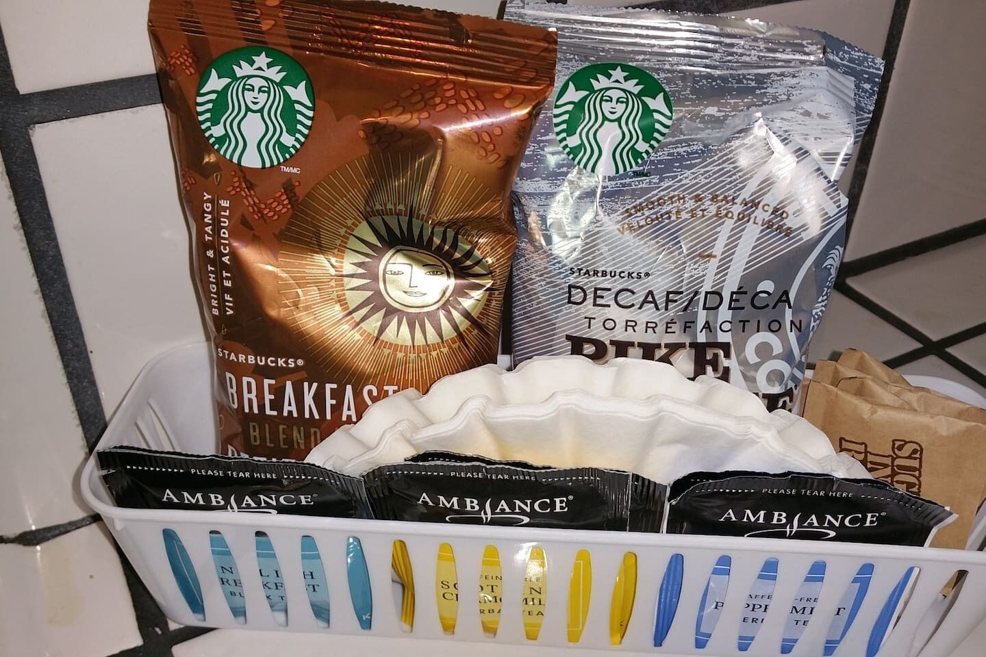A Starbucks coffee bag and a Starbucks decaf coffee bag.