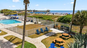 A heated pool - Tropical Oasis at Chateau by the Sea Family and Pet Friendly Beachfront Escape (Cocoa Beach)