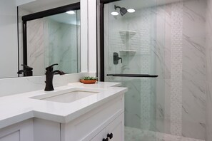 Combined shower/tub, hair dryer, towels, soap