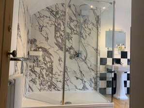 Bathtub, hair dryer, towels, soap