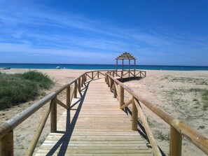 On the beach, sun-loungers, beach towels
