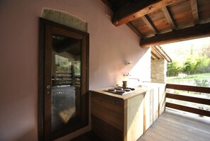 A wooden-framed window with a view of a garden. - House in the woods, entire house free on 4 sides in the Tuscan hills (Rufina)