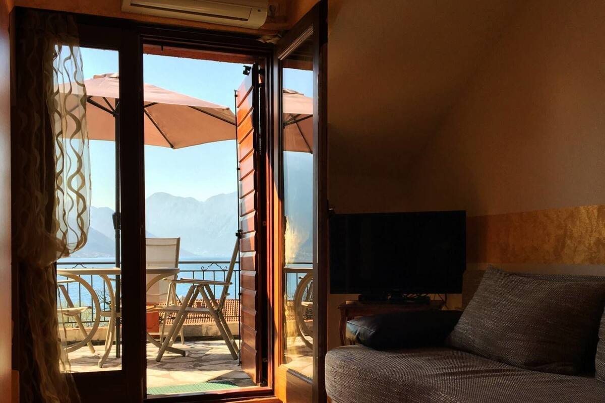 Studio, Sea View | Living area | Flat-screen TV