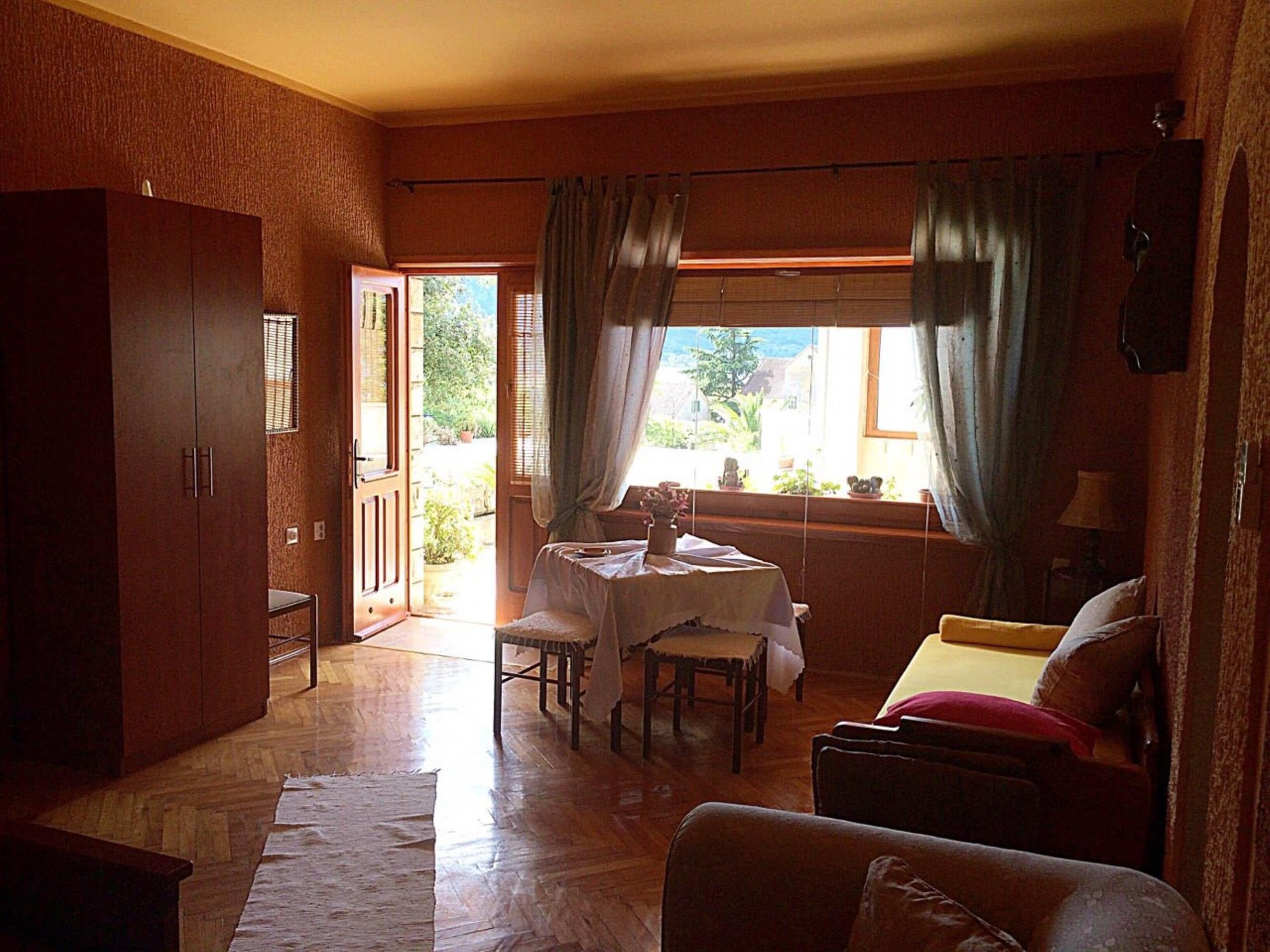 Comfort Apartment, Patio, Sea View | Living area | Flat-screen TV
