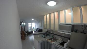 Full-sized fridge, coffee/tea maker, cookware/dishes/utensils