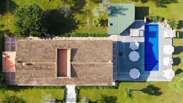 An aerial view of a property with a swimming pool, outdoor seating, and a covered patio area. - 780533 Finca s'hort de conies (Manacor)