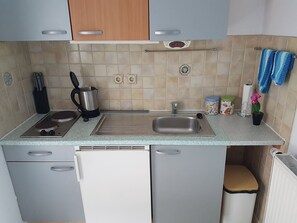 Fridge, electric kettle, toaster, cookware/dishes/utensils
