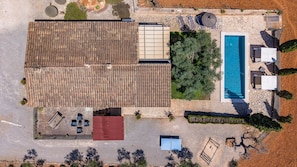 An aerial view of a property with a swimming pool, outdoor seating, and a covered patio area. - 44250 Finca Es Estador (Manacor)