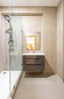 Separate tub and shower, deep soaking tub, bathrobes, slippers