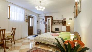 Apartment, 1 Bedroom | Living area | Flat-screen TV