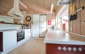 Fridge, stovetop, dishwasher, coffee/tea maker
