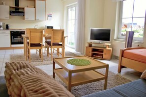 Comfort appartement | Woonruimte | Een flatscreentelevisie