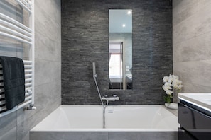 Bathtub, hair dryer, towels