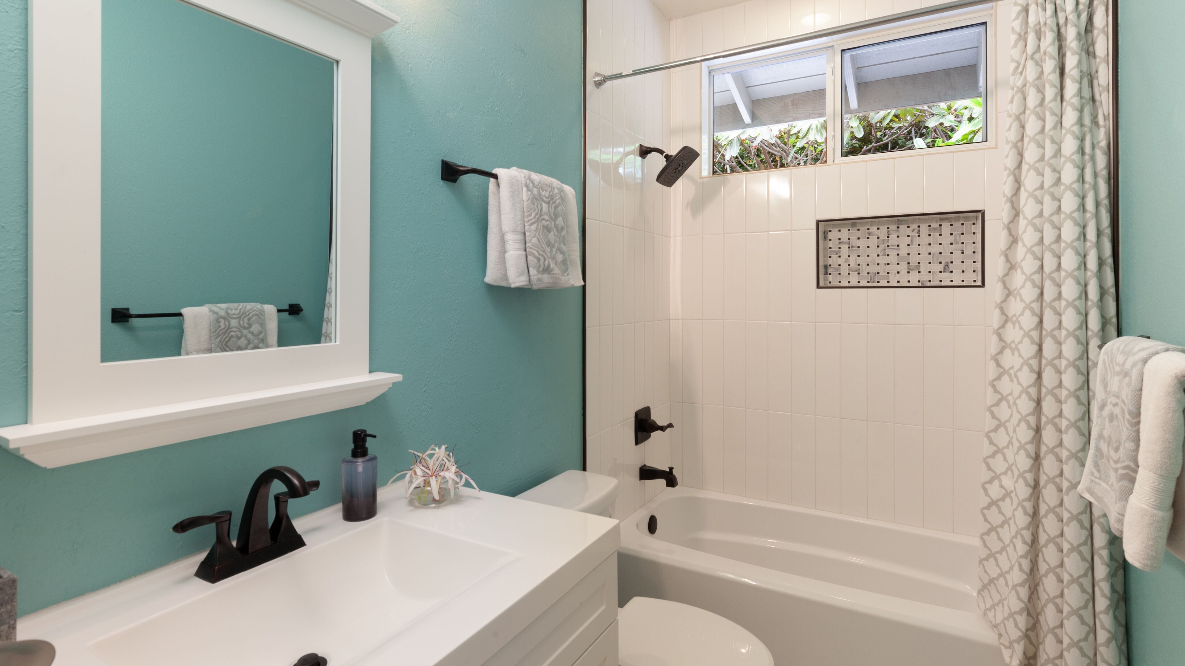 Combined shower/tub, hair dryer, towels, soap