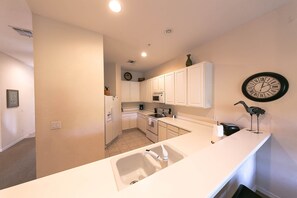 Microwave, dishwasher, coffee/tea maker, cookware/dishes/utensils