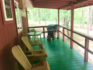 REAR DECK WITH CHAIRS AND TABLE AND GAS GRILLE