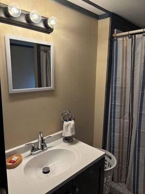 Combined shower/tub, hair dryer, towels, soap