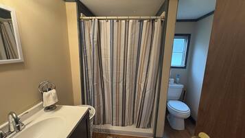 Combined shower/tub, hair dryer, towels, soap