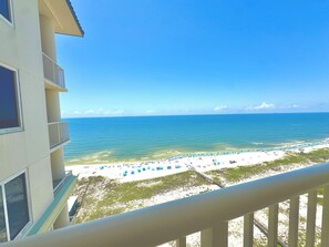 A balcony with a view of a beach and ocean. - Beach Club Avalon Penthouse 2003 Direct Gulf Views/5 Kings Total Renovation! (Gulf Shores)