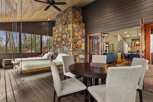 Situated in the forest surrounded by trees, mountain views, and a mini waterfall