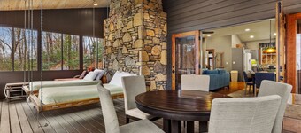 Situated in the forest surrounded by trees, mountain views, and a mini waterfall