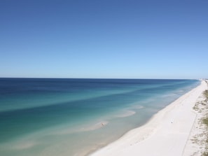 A beach with clear turquoise waters and a sandy shore. - Everyone deserves a litte vacay! Please, come see me, Love ~ The Beach (Panama City Beach)