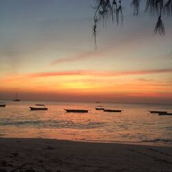 On the beach, white sand, sun-loungers, beach umbrellas