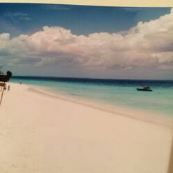 On the beach, white sand, sun-loungers, beach umbrellas