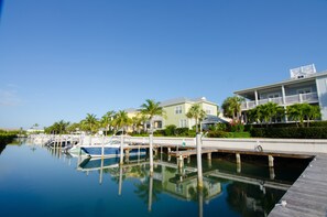Enjoy serene waterfront views from the comfort of your balcony overlooking the tranquil marina.