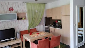 Apartment, 1 Bedroom | Living room | Flat-screen TV, DVD player