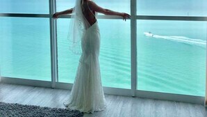 A room with large windows overlooking a body of water and a distant shoreline. - Spectacular Views!!  Beautifully Updated!!  No Resort Fees! (Fort Myers Beach)