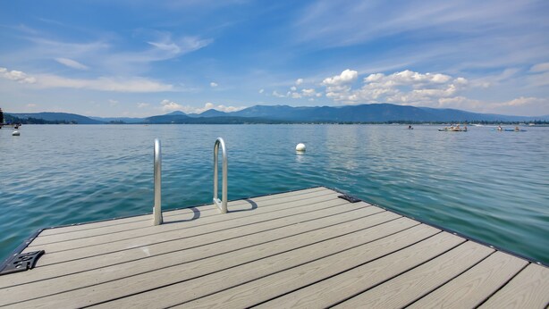 A wooden dock extending into calm water with mountains in the background. - 16 Mi to Schweitzer Mtn: Family Gem in Sagle! (Sagle)