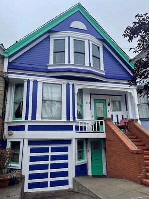 Stunning two-story residence with a gabled facade, bay window, and inviting front porch.