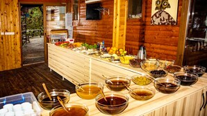 A buffet setup with various food items and condiments. - Fullmoon Camping (Fethiye)