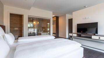 Luxe beddengoed, een minibar, een kluis op de kamer, een bureau